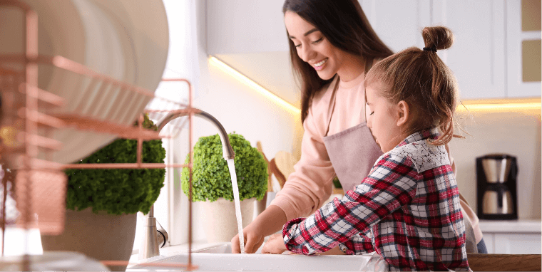 Mother And Daughter Wash Her Hands
