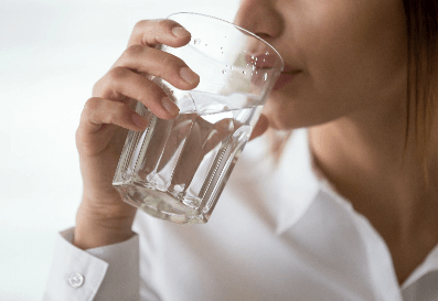 Young Woman Drinking Water